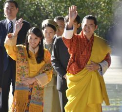 Bhutan's King Wangchuck and Queen Wangchuck wave during their welcoming ceremony at the Imperial Palace in Tokyo